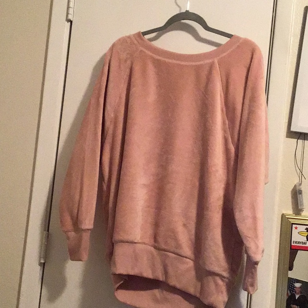 A used light pink sweater